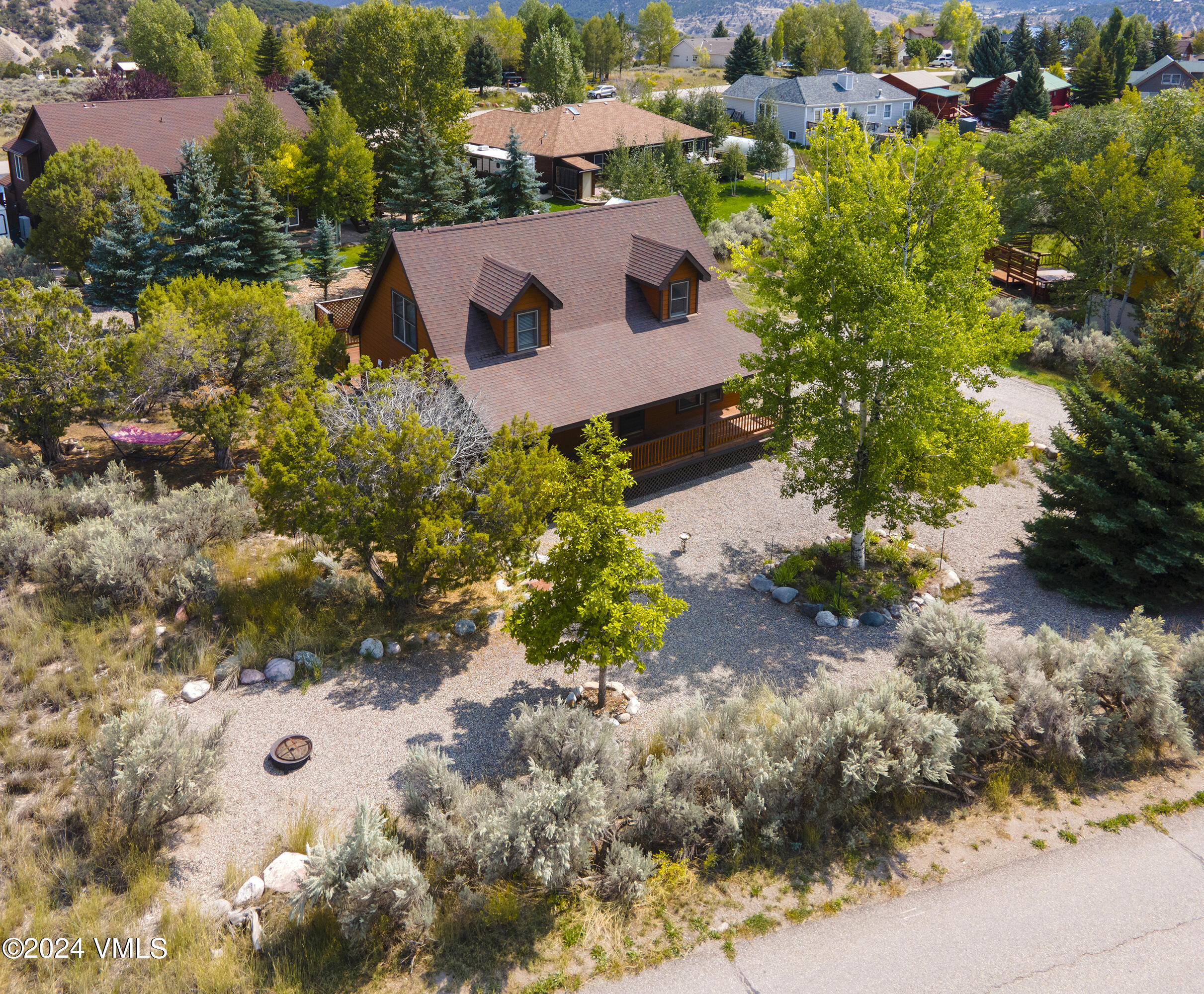490 Neilson Gulch Road Eagle, CO 81631 - Photo 40 of 55 an aerial view of a house with a yard and lake view