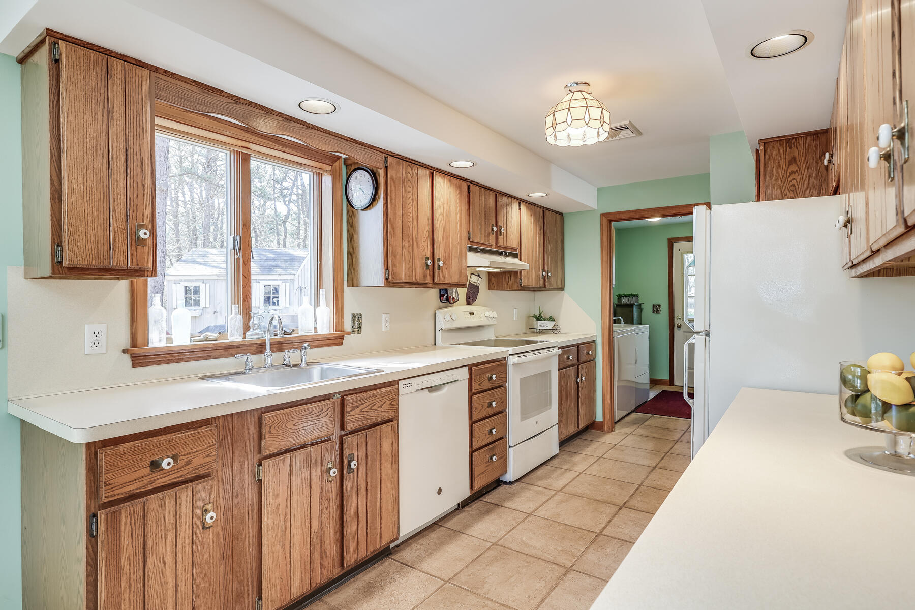 35 Sea Pine Road Wellfleet, MA 02667 - Photo 11 of 36 a kitchen with a sink stove and cabinets