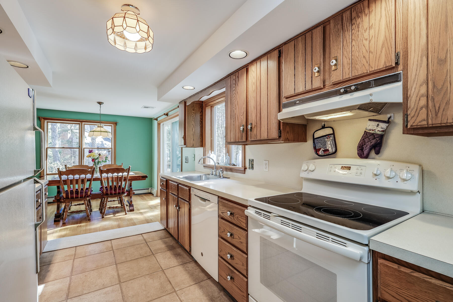 35 Sea Pine Road Wellfleet, MA 02667 - Photo 12 of 36 a kitchen with a stove a sink and a refrigerator