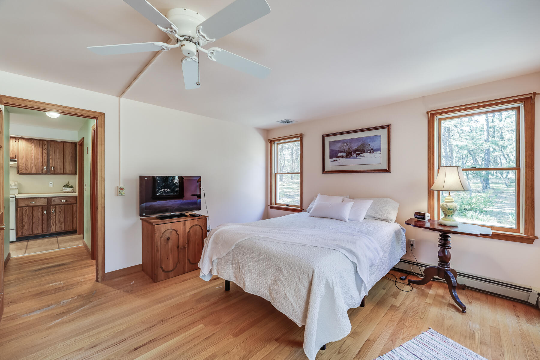 35 Sea Pine Road Wellfleet, MA 02667 - Photo 15 of 36 a bedroom with a bed and a flat screen tv