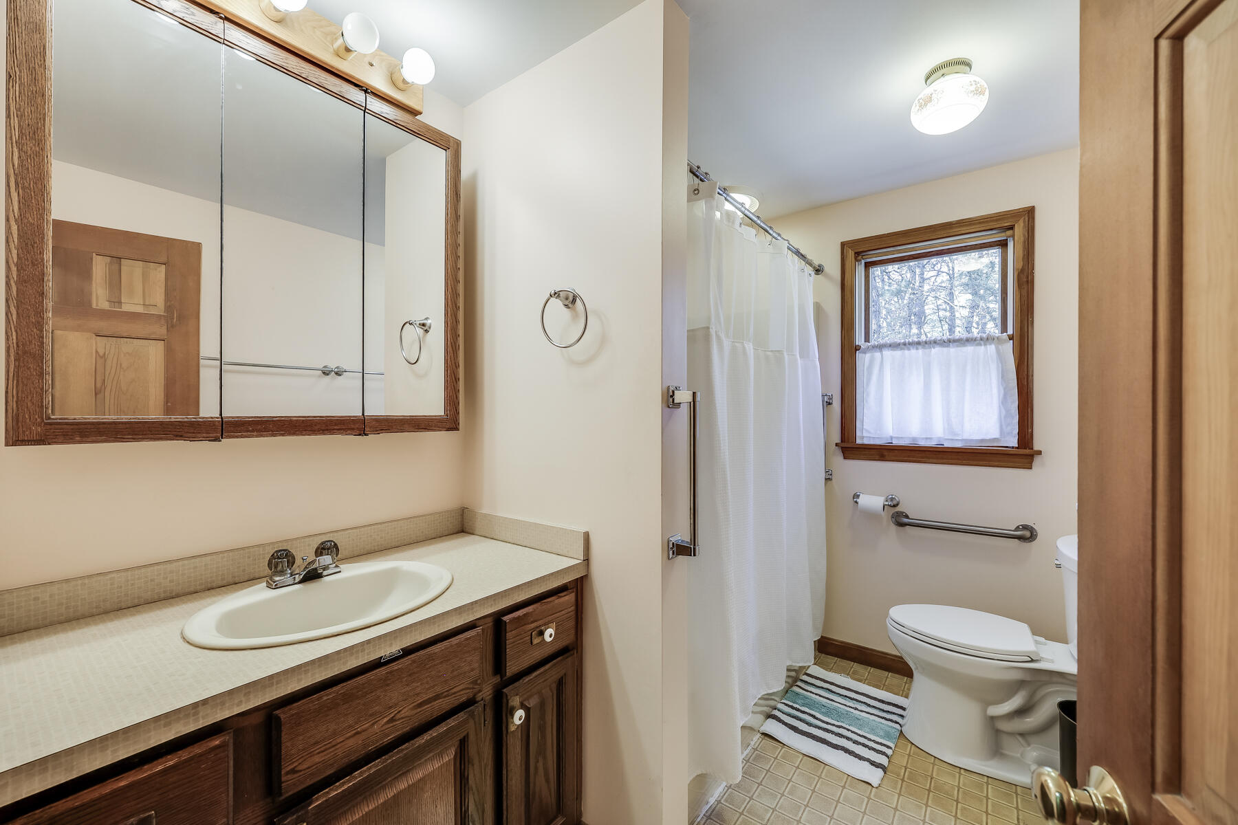35 Sea Pine Road Wellfleet, MA 02667 - Photo 16 of 36 a bathroom with a sink a toilet and shower