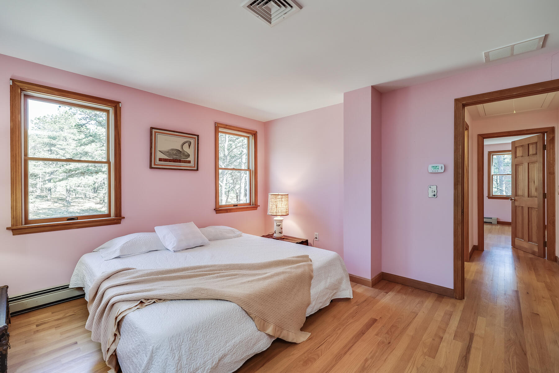 35 Sea Pine Road Wellfleet, MA 02667 - Photo 19 of 36 a bedroom with a bed and wooden floor