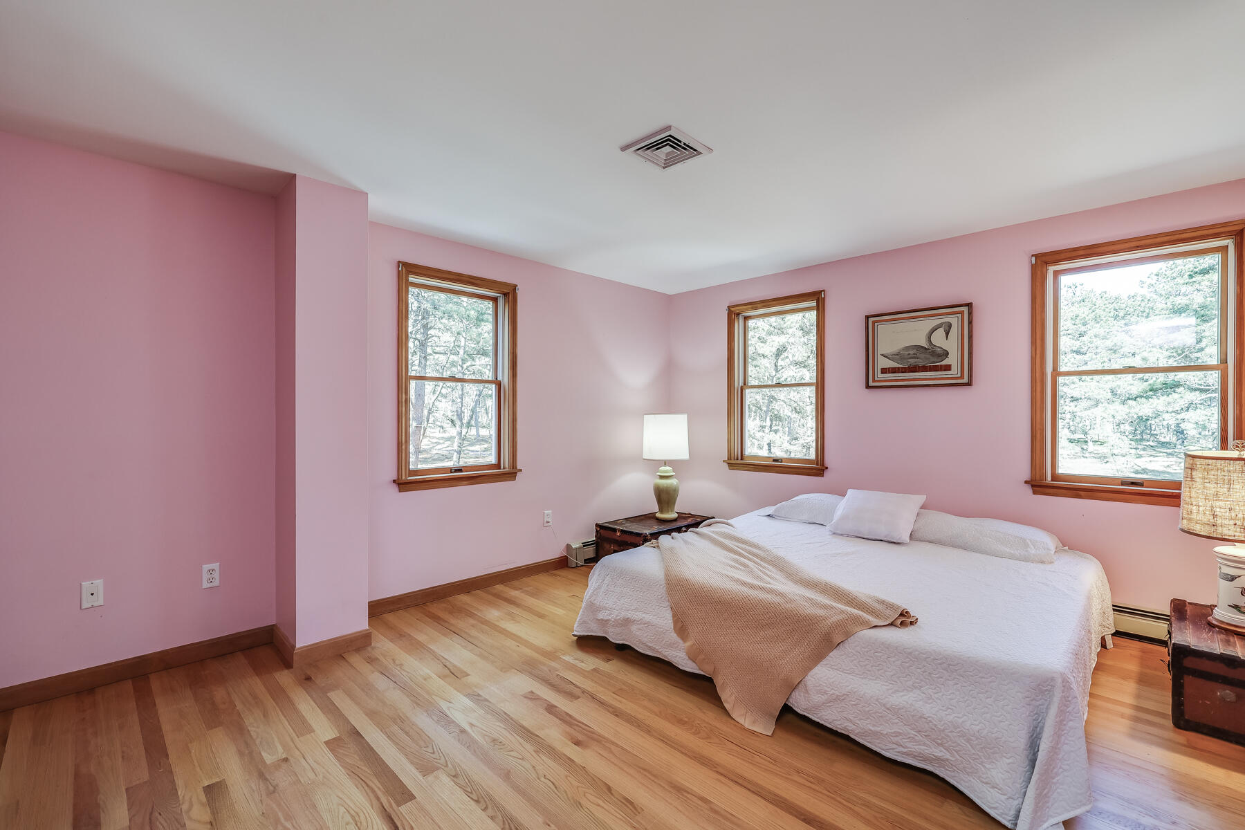 35 Sea Pine Road Wellfleet, MA 02667 - Photo 20 of 36 a bedroom with a bed and wooden floor