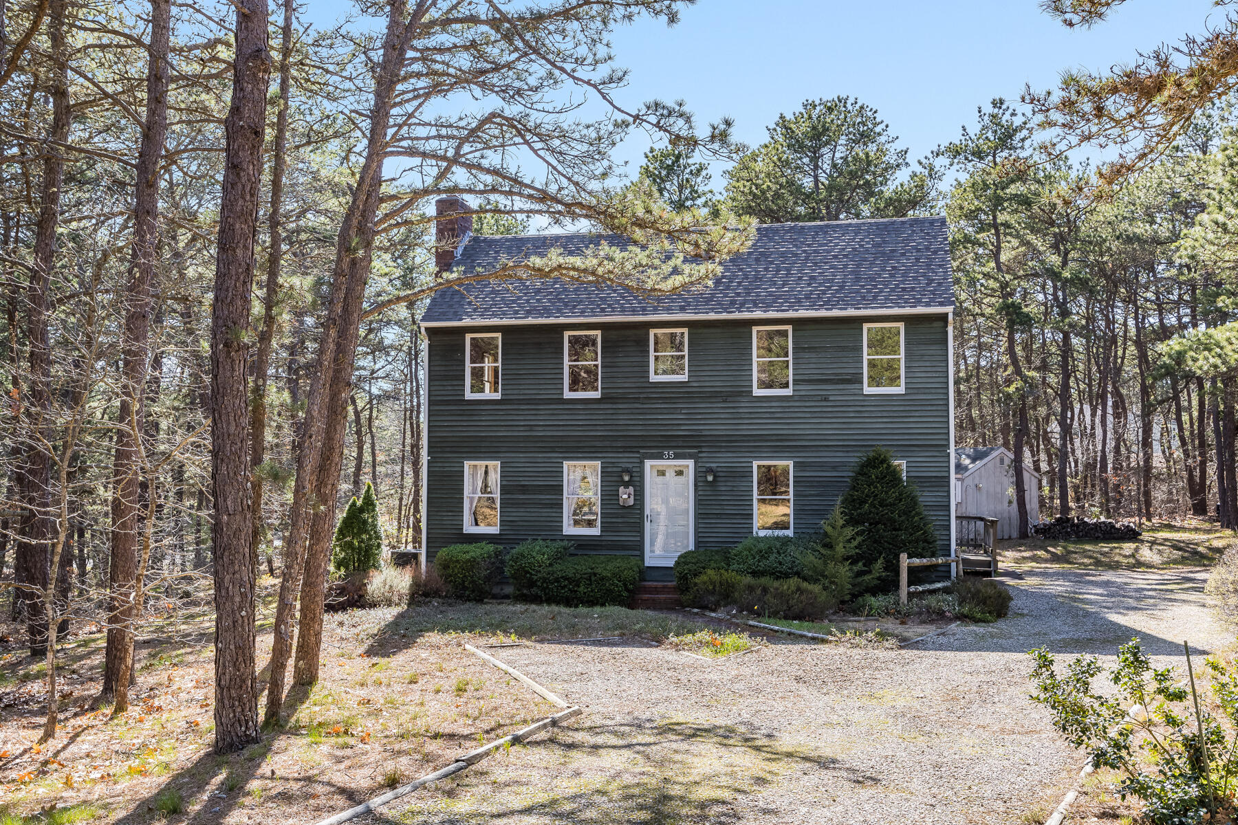 35 Sea Pine Road Wellfleet, MA 02667 - Photo 27 of 36 a front view of a house with a yard