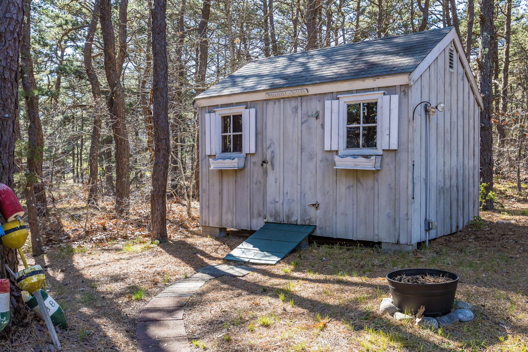 35 Sea Pine Road Wellfleet, MA 02667 - Photo 29 of 36 a view of a backyard with plants and trees
