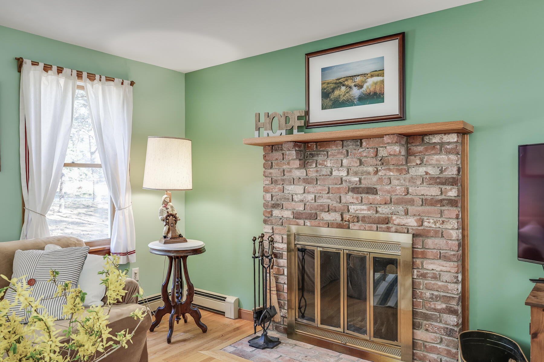 35 Sea Pine Road Wellfleet, MA 02667 - Photo 5 of 36 a living room with furniture and a fireplace
