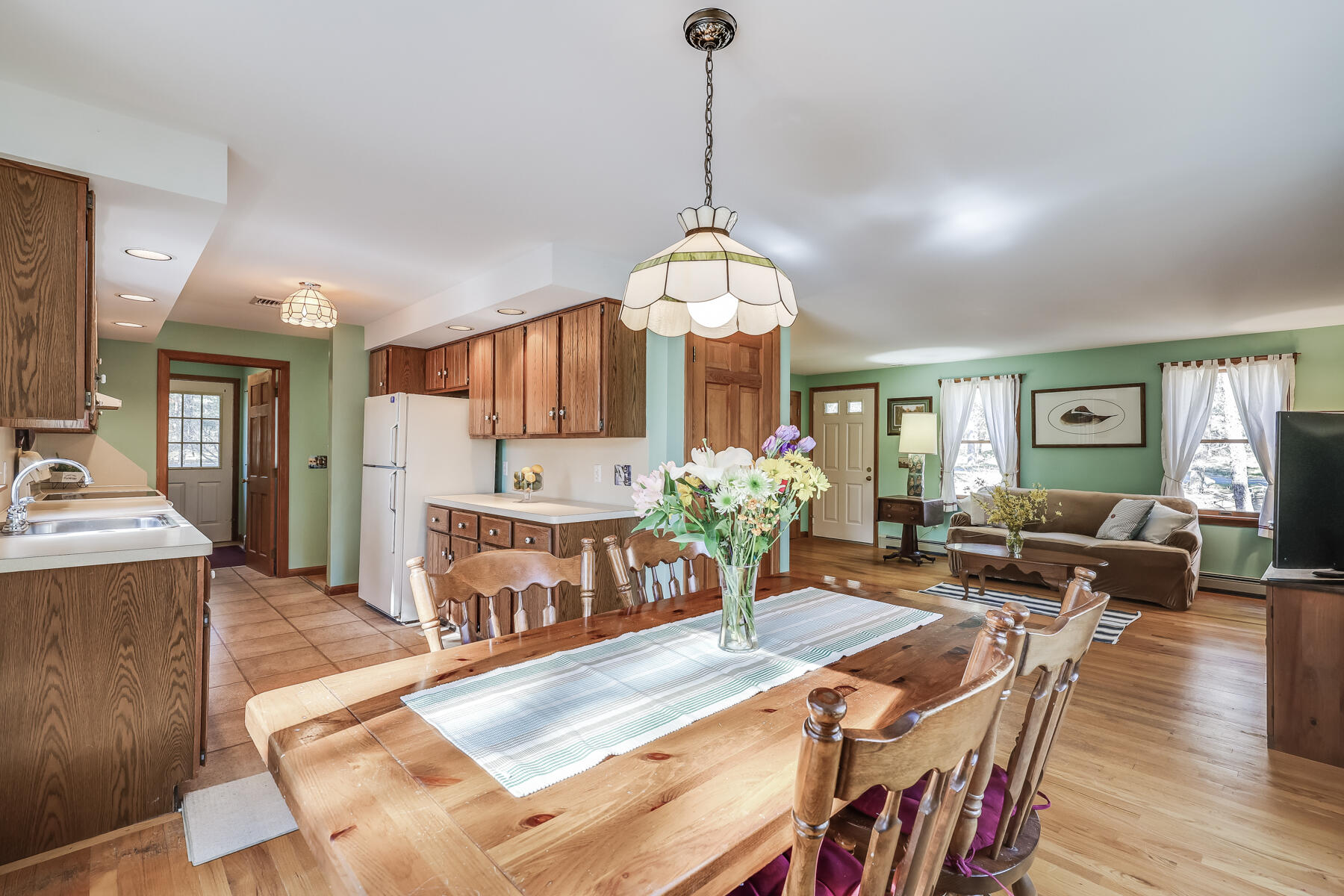 35 Sea Pine Road Wellfleet, MA 02667 - Photo 6 of 36 a living room with fireplace furniture and a chandelier