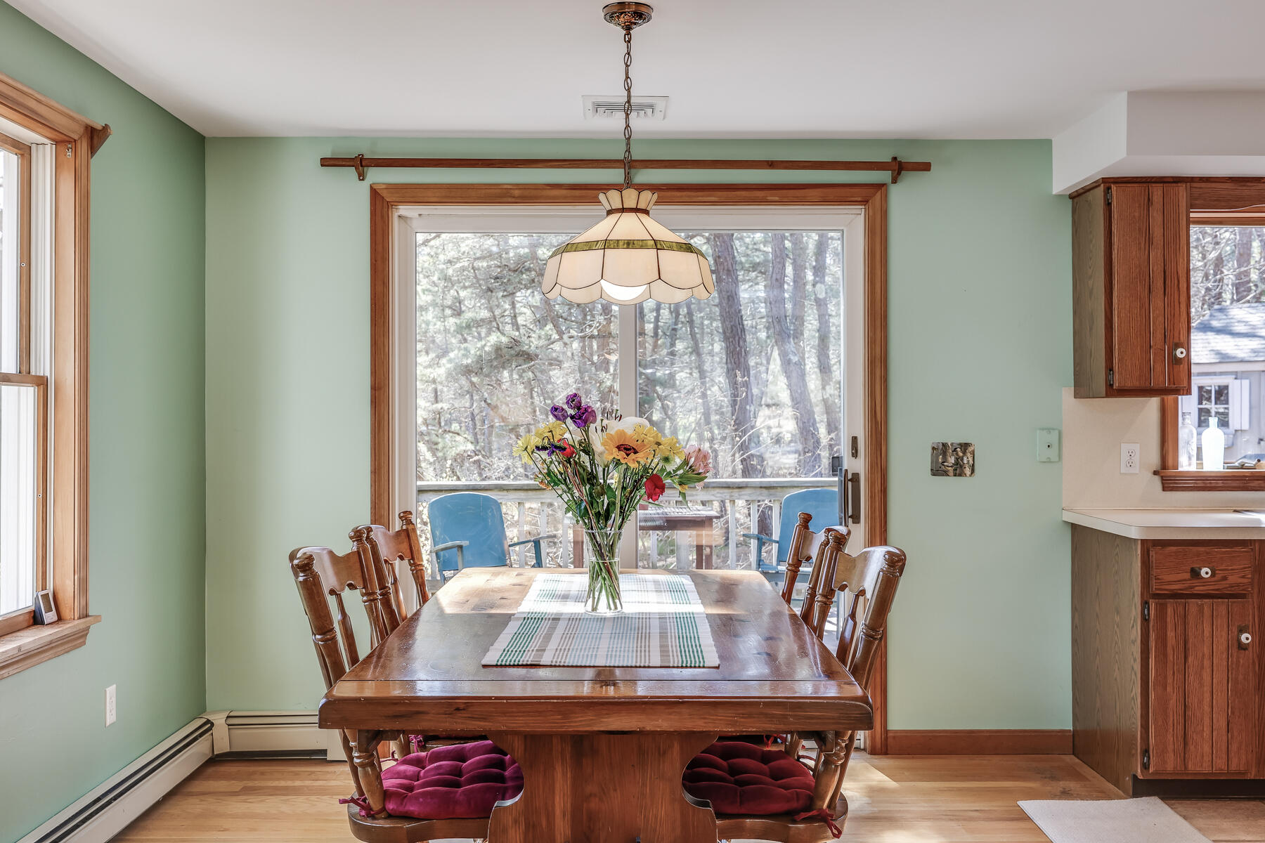 35 Sea Pine Road Wellfleet, MA 02667 - Photo 8 of 36 a dining room with furniture a chandelier and wooden floor
