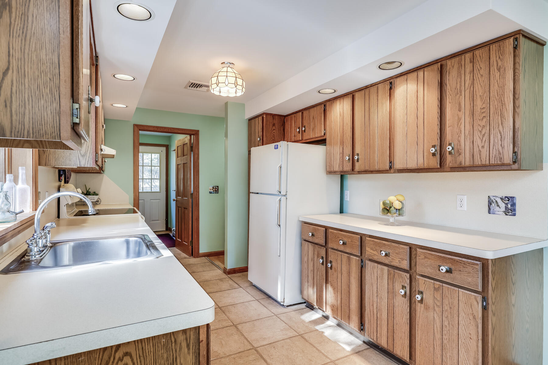35 Sea Pine Road Wellfleet, MA 02667 - Photo 9 of 36 a kitchen that has a sink cabinets and wooden floor