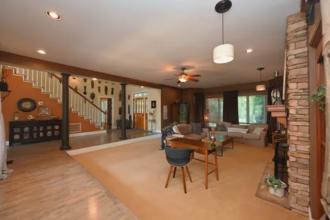 a view of entryway wih livingroom and stairs