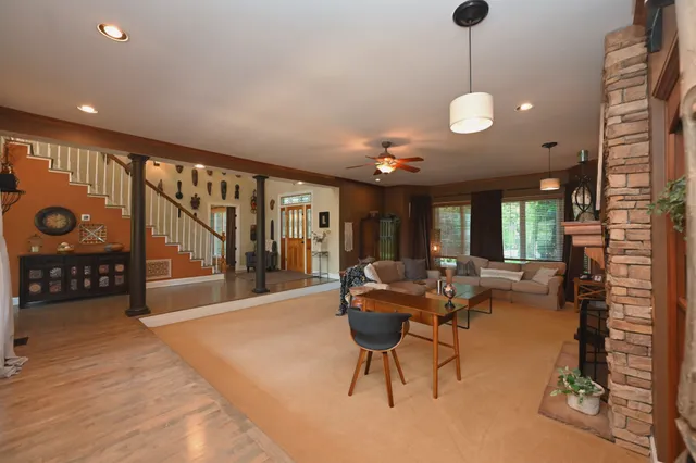a view of entryway wih livingroom and stairs