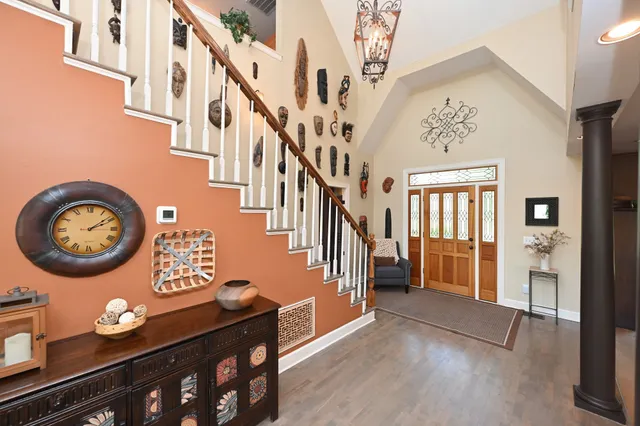 a kitchen with stainless steel appliances kitchen island granite countertop a sink stove and cabinets