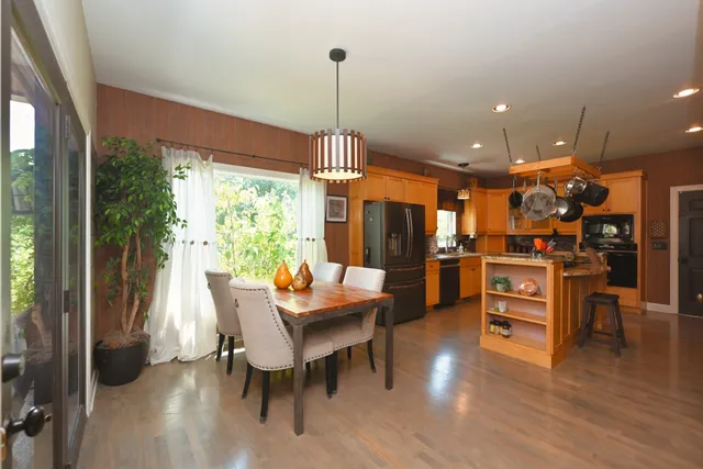 a kitchen with granite countertop a sink cabinets and window