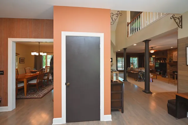 a bathroom with a granite countertop shower sink vanity and toilet