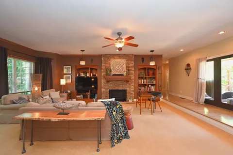 a view of staircase with railing and white walls