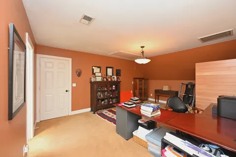 a view of a hallway with stairs