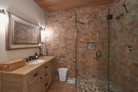 a bedroom with a bed dresser and a window