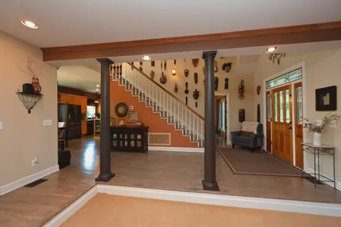 a bathroom with a tub and a window