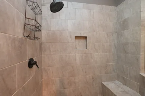 an aerial view of a house with yard and outdoor seating