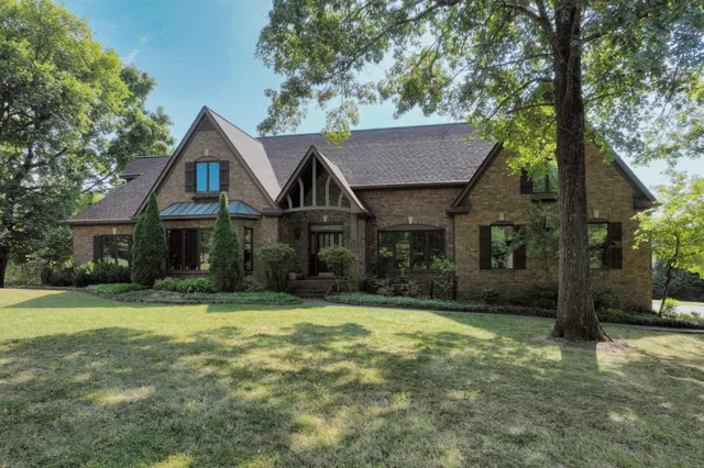 a view of a house with potted plants