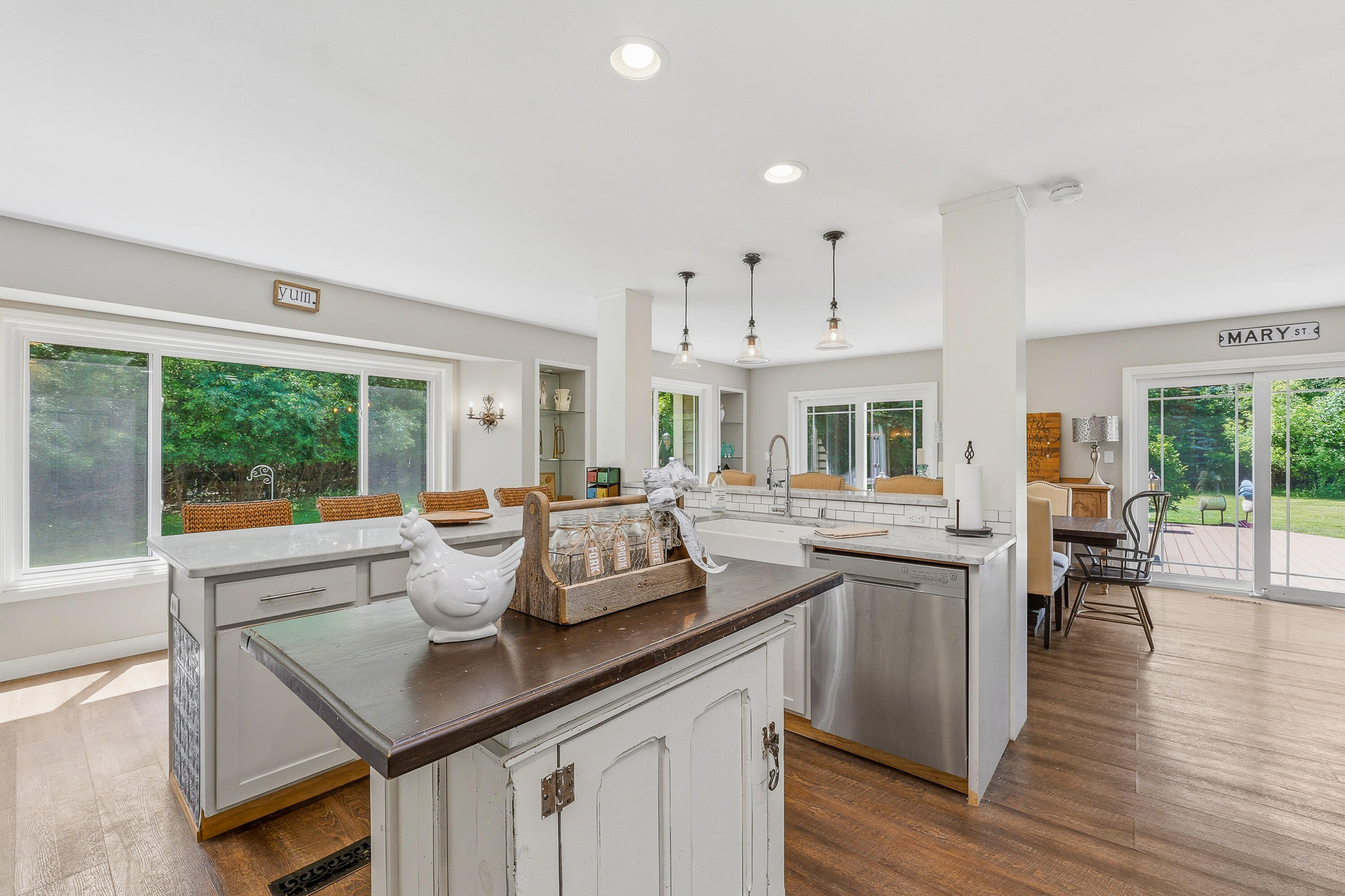 34899 Pabst Road Summit, WI 53066 - Photo 5 of 38 A kitchen designed to take in the beauty of the surrounding yard, with large windows that bring the outdoors in.