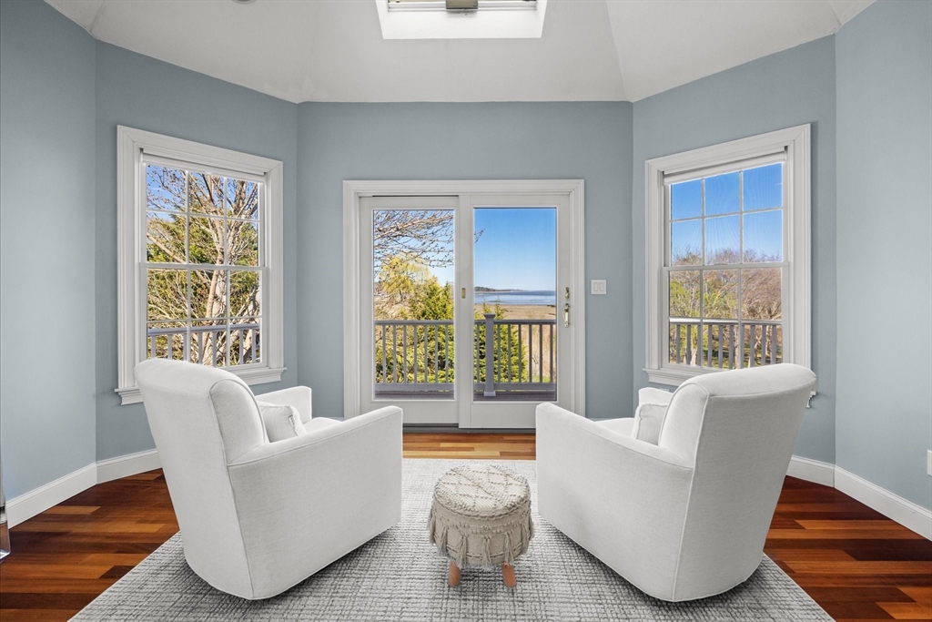 735 Bay Road Duxbury, MA 02332 - Photo 16 of 40 a living room with furniture and a large window