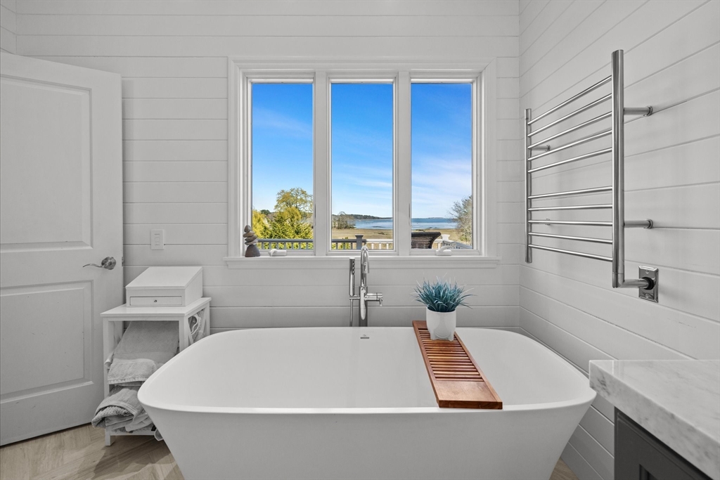 735 Bay Road Duxbury, MA 02332 - Photo 17 of 40 a white bath tub sitting in a bathroom