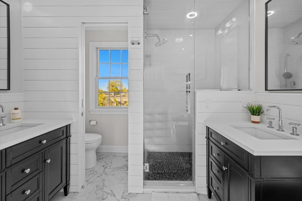 735 Bay Road Duxbury, MA 02332 - Photo 21 of 40 a bathroom with a sink a toilet and shower