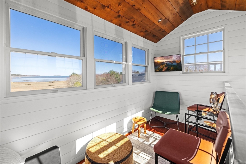 735 Bay Road Duxbury, MA 02332 - Photo 27 of 40 a view of a chairs and table in a patio