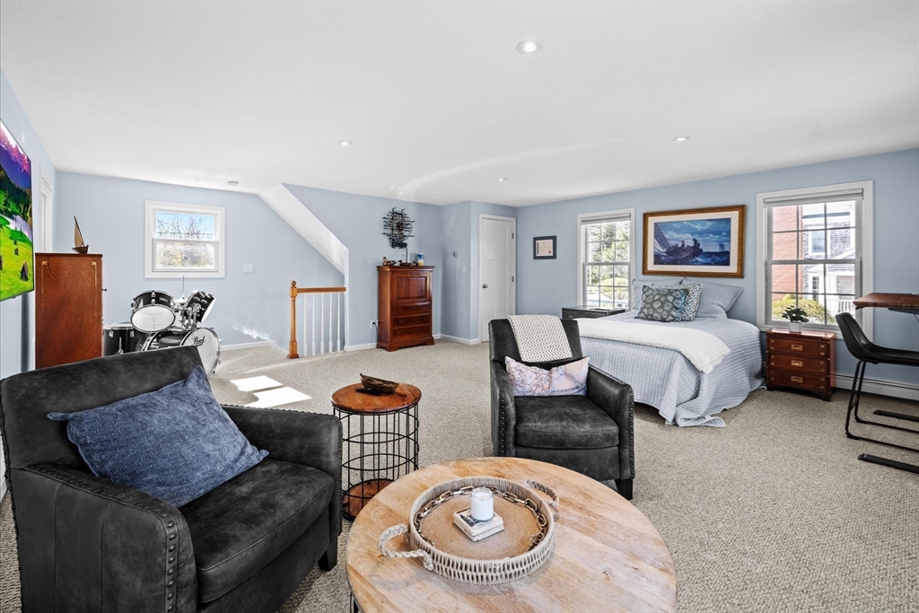 735 Bay Road Duxbury, MA 02332 - Photo 37 of 40 a bedroom with furniture and a wooden floor