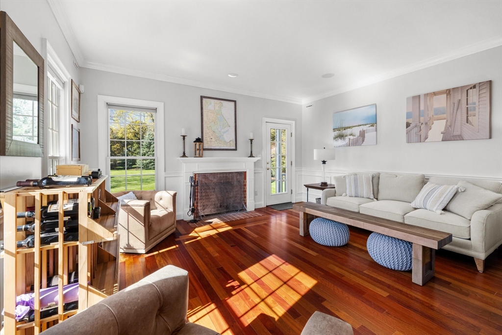 735 Bay Road Duxbury, MA 02332 - Photo 4 of 40 a living room with furniture fireplace and a table