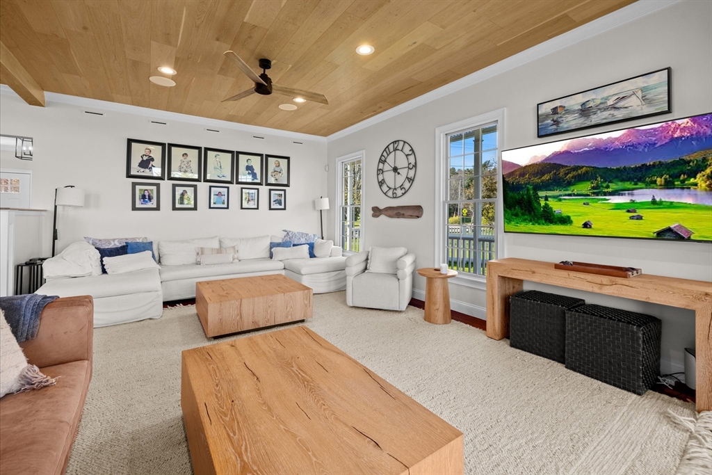 735 Bay Road Duxbury, MA 02332 - Photo 7 of 40 a spacious bedroom with a bed and a flat screen tv