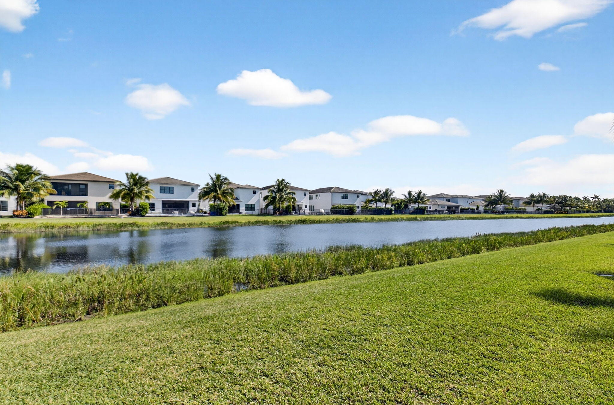 8573 Apple Falls Lane Boca Raton, FL 33496 - Photo 68 of 102 a view of a lake with houses in the back
