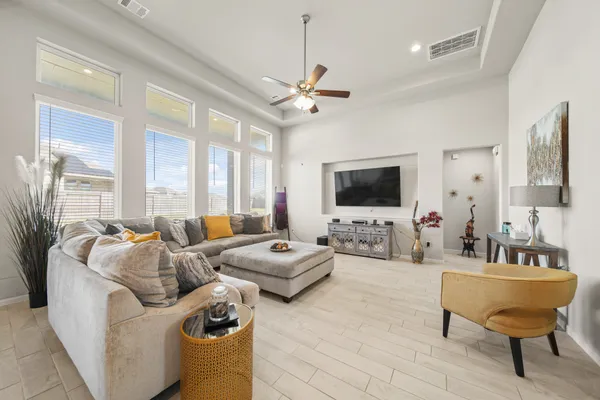 a living room with furniture and a flat screen tv