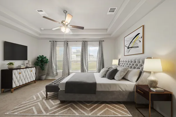 a bedroom with a large bed and a flat screen tv