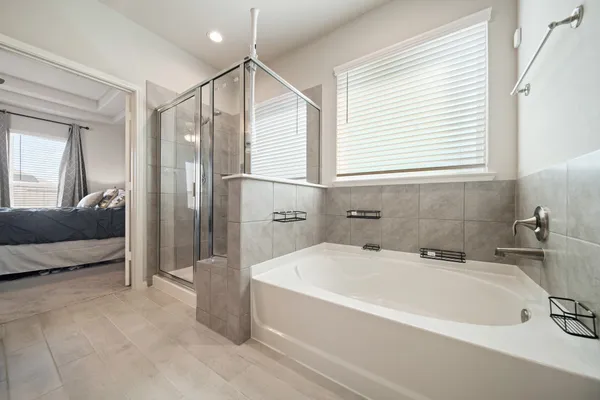 a bathroom with a bathtub and a sink