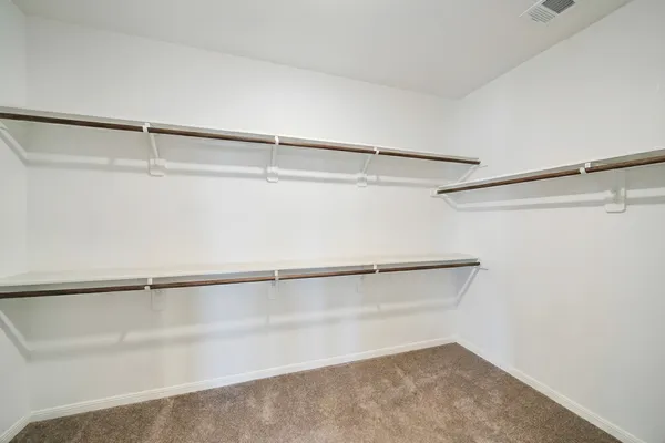 a view of a room with racks on the wall