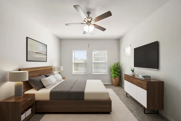 a spacious bedroom with a bed and a flat screen tv