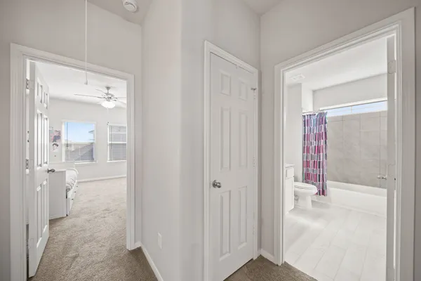 a view of a bathroom from a hallway