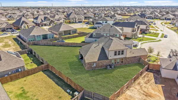 an aerial view of a house with a swimming pool