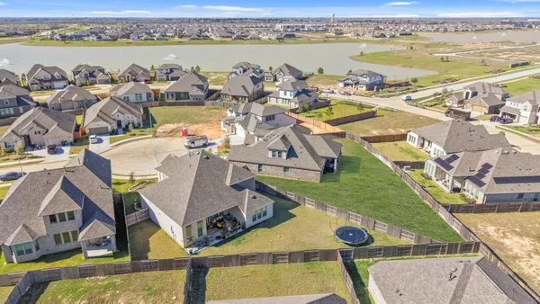 an aerial view of a house with outdoor space