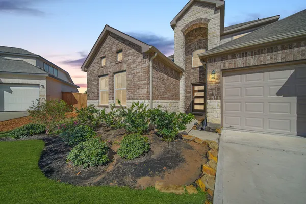 front view of a house with a small yard