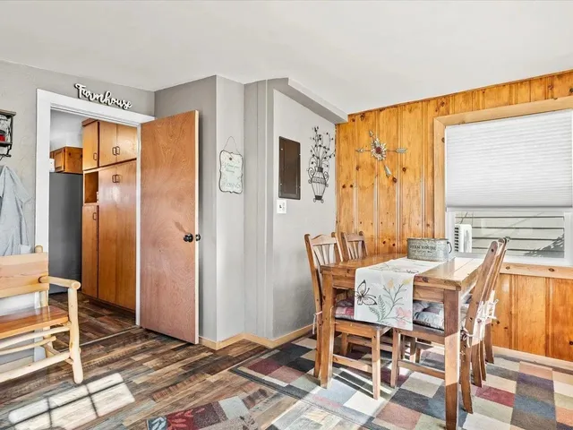 a dining room with furniture and window