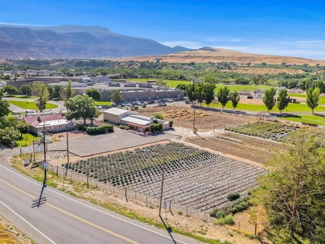 a view of a terrace with furniture and a city view