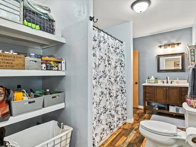 a bathroom with a sink toilet and shower