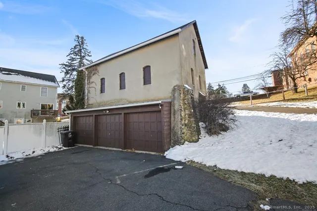 a view of a house with a snow in the background