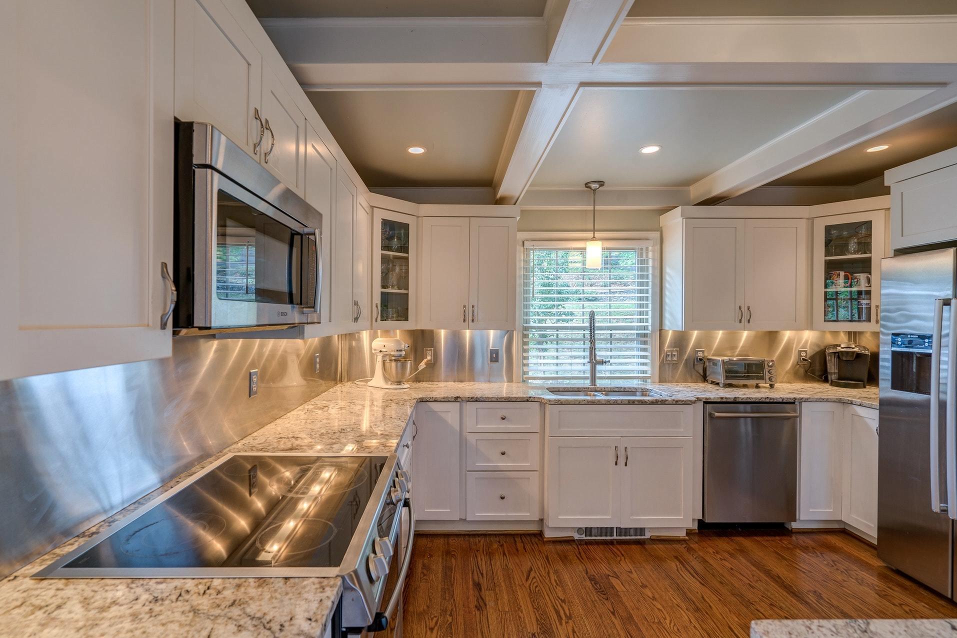 209 Parkcrest Road Southwest Roanoke, VA 24014 - Photo 19 of 48 a kitchen with stainless steel appliances granite countertop a stove and a wooden floors