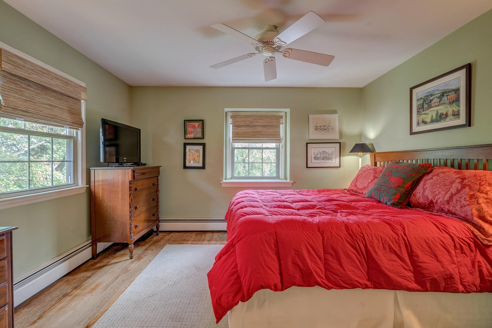209 Parkcrest Road Southwest Roanoke, VA 24014 - Photo 35 of 48 a bedroom with a large bed and a flat screen tv
