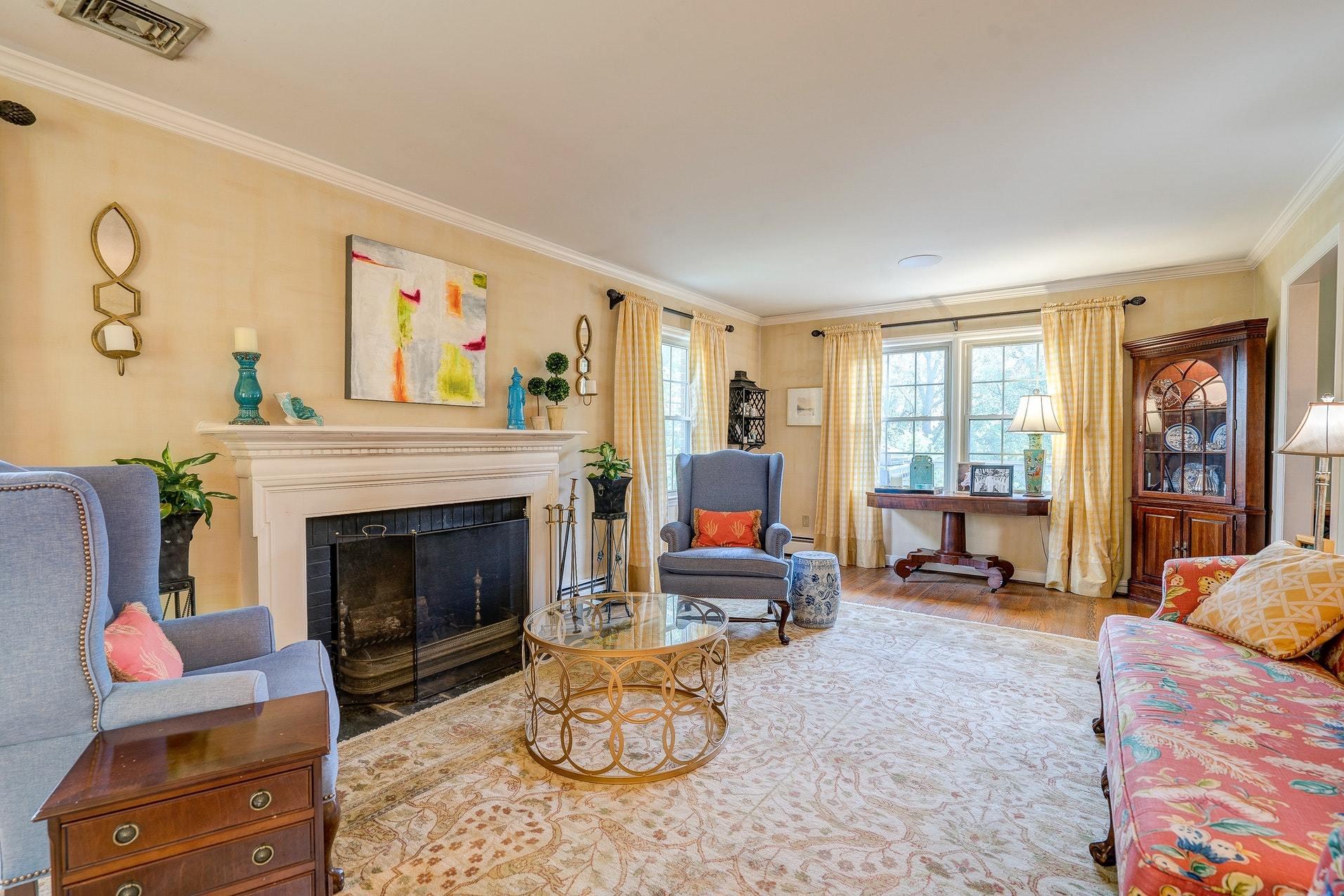 209 Parkcrest Road Southwest Roanoke, VA 24014 - Photo 5 of 48 a living room with furniture a fireplace and large windows