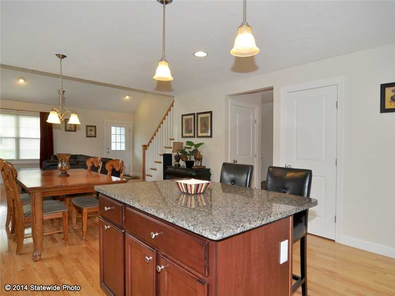 16 Mill Pond Road, Unit 16 Burrillville, RI 02830 - Photo 25 of 25 Kitchen. Open floor plan for kitchen, dining room and living room all hardwood floors
